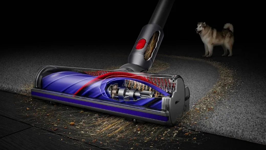 Dyson V8 cordless stick vacuum cleaner in silver and red, shown upright